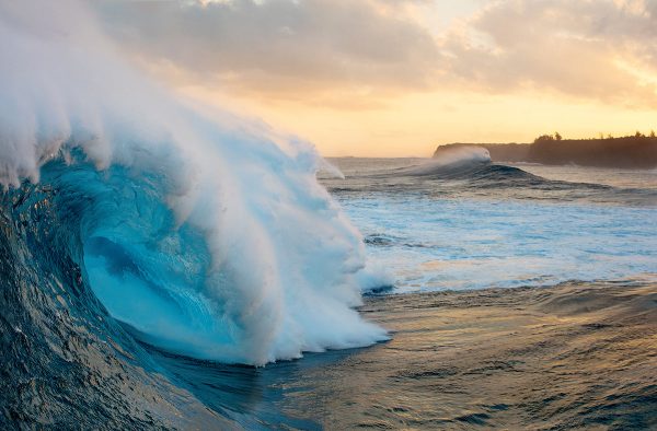 Majestic scenic big wave with white foam curling in a blue marine water
