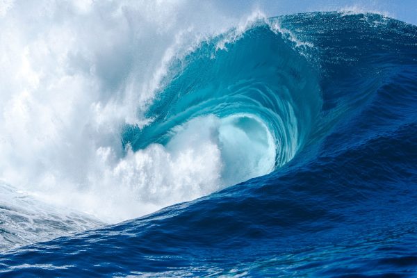 Powerful big wave in the ocean with white foam in teahupoo, waimea bay, mavericks