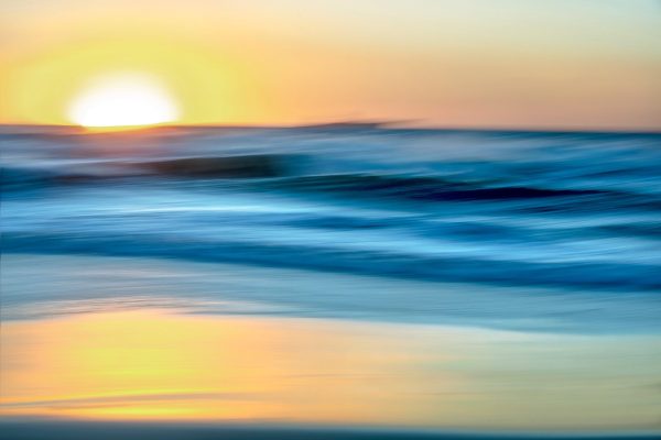 Abstract blurred image of a sunset over water