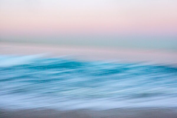 Abstract blurred image of water and sky with soft colors