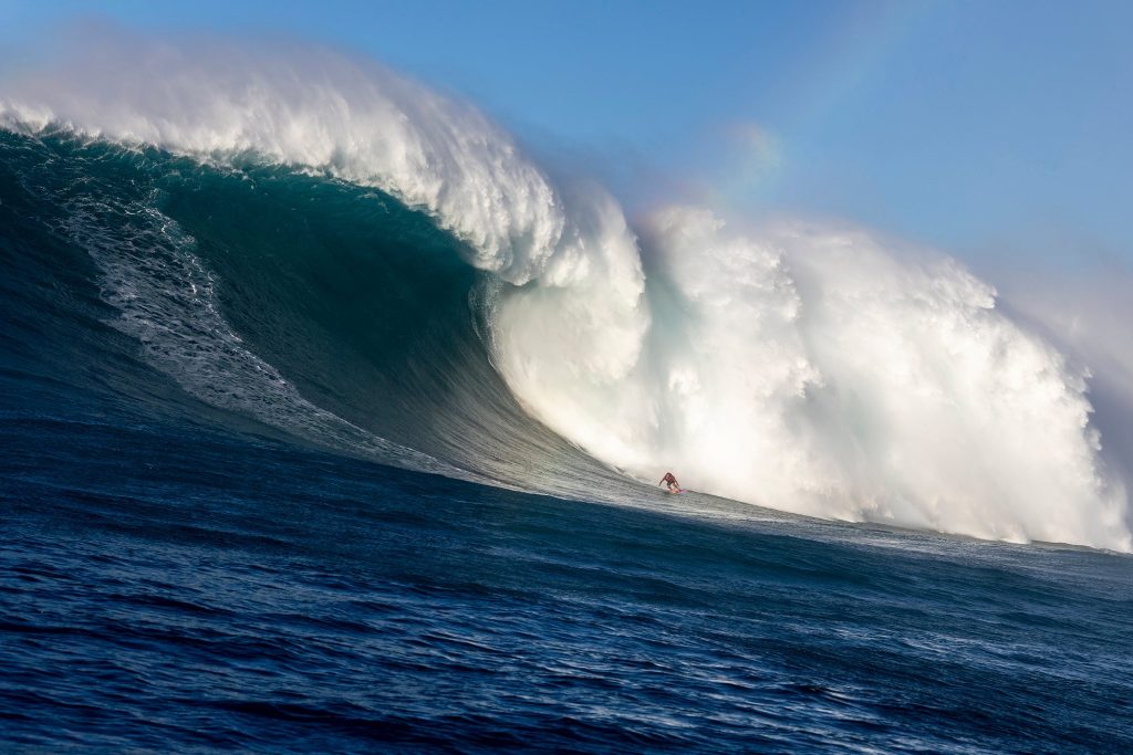 Benjamin Sanchis descending an 80-foot mountain of water at Jaws (Peʻahi) during the historic December 22, 2024 swell.